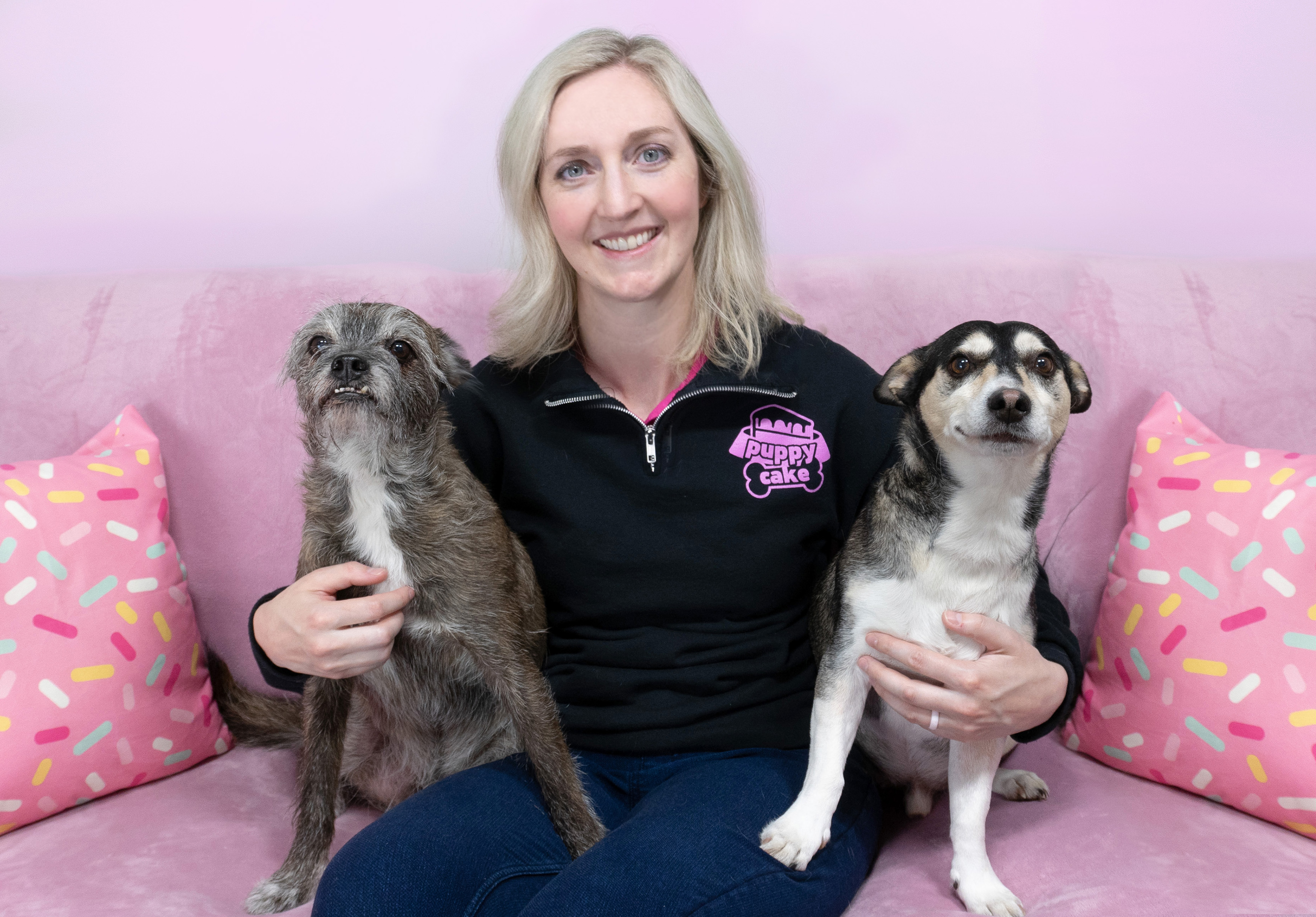 Kelly, the CEO of Puppy Cake, with her two dogs.